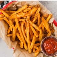 Overhead view of fries, text overlay reads "air fryer sweet potato fries, rachelcooks.com"