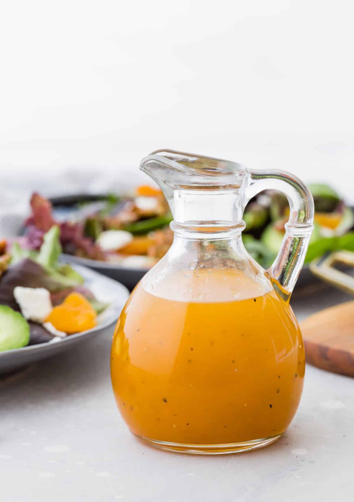 Apricot vinaigrette in a small glass pitcher.