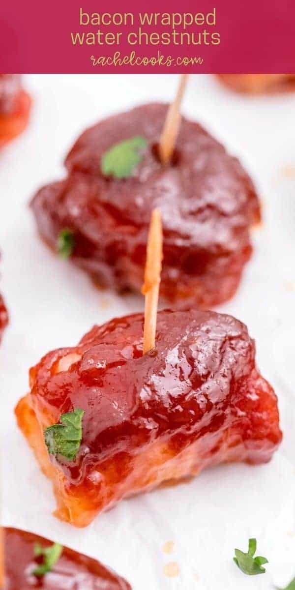 Close up of an appetizer on a toothpick, text overlay reads "bacon wrapped water chestnuts"
