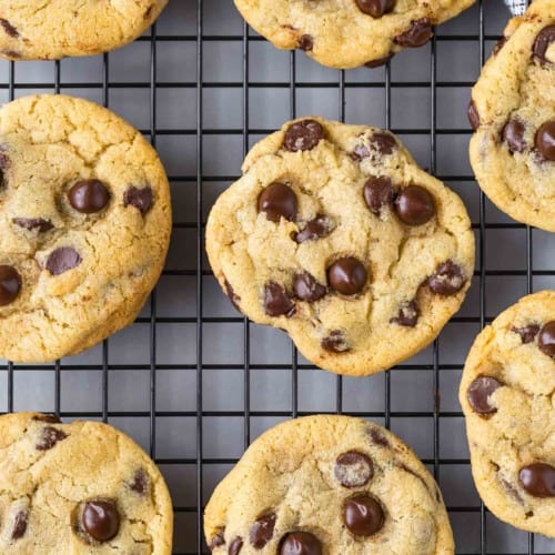 Close-up image of chewy chocolate chip cookies on a cooling rack.