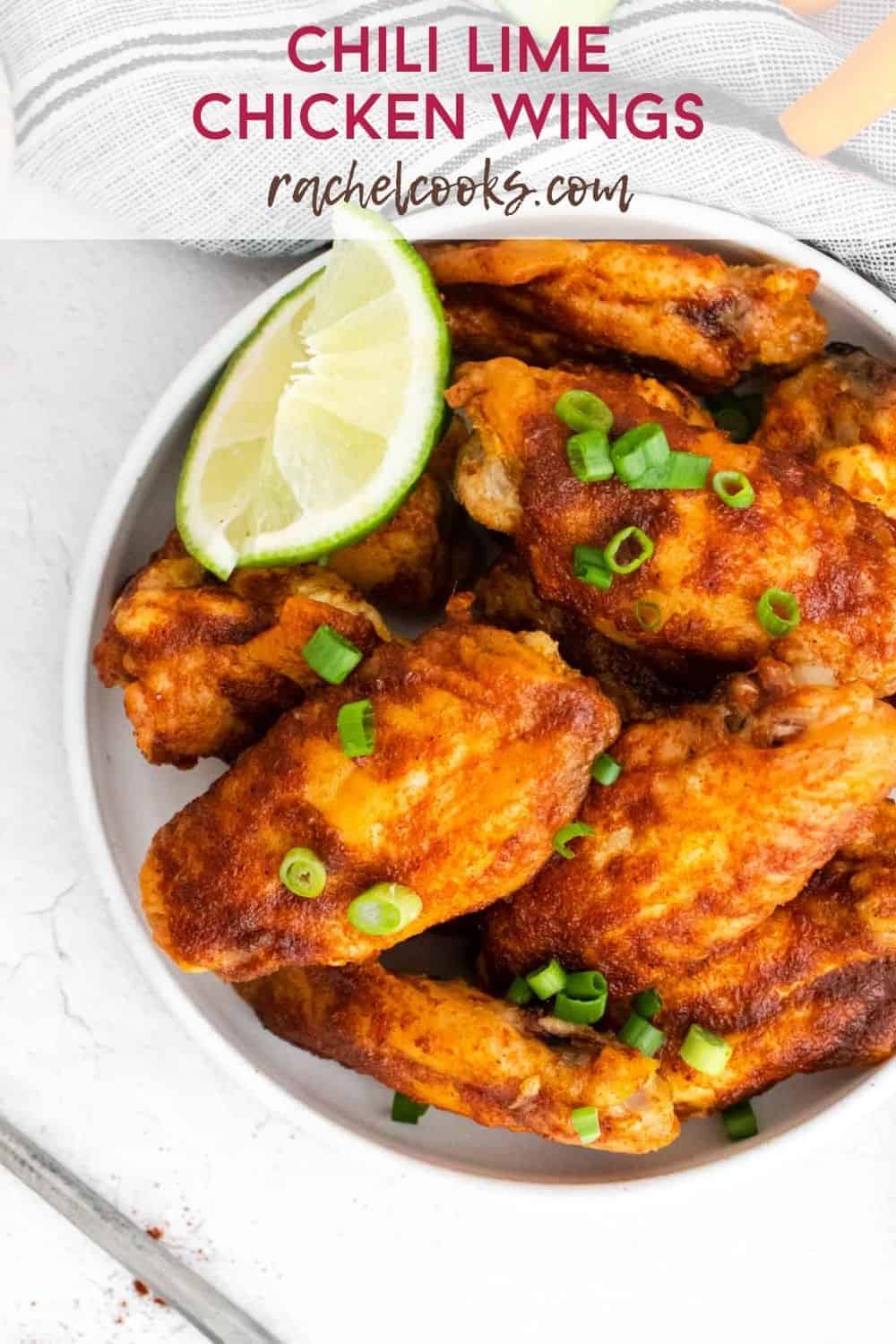 Wings in a white dish, text overlay reads "chili lime chicken wings"