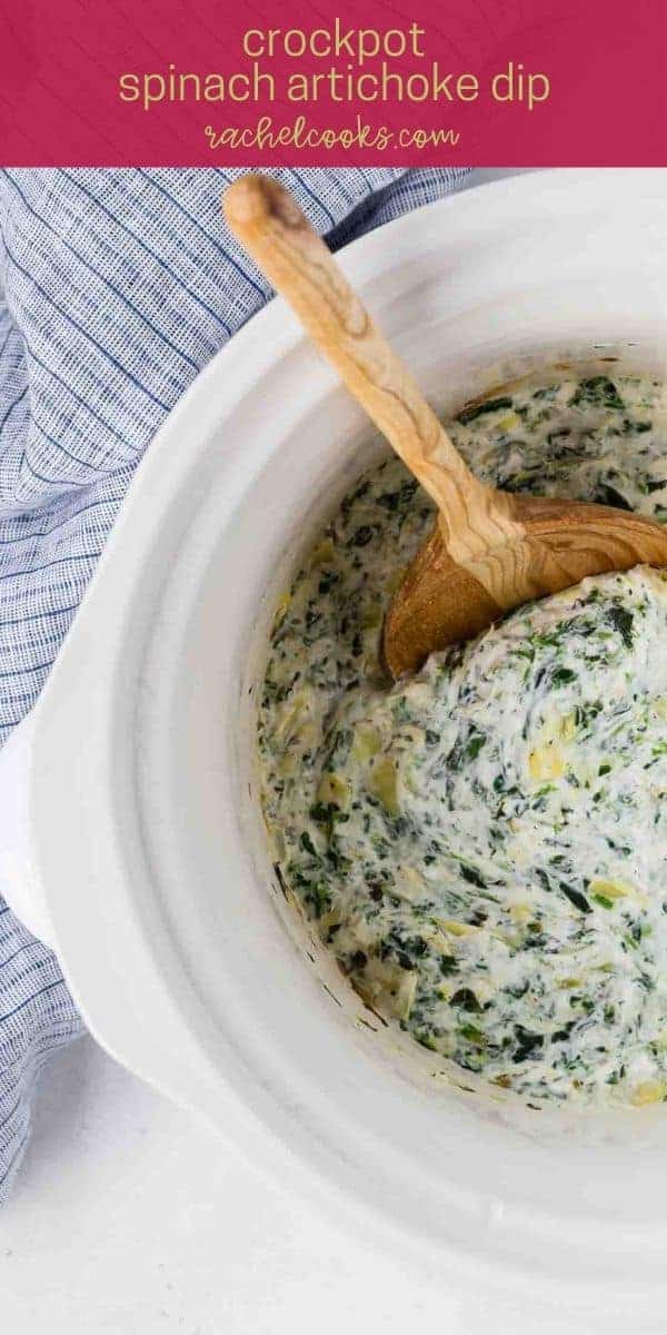 Spinach dip in a black dish, text overlay reads "crockpot spinach artichoke dip, rachelcooks.com"