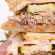 Close up of cut Cuban sandwich, text overlay reads "Cuban Sandwich, RachelCooks.com"
