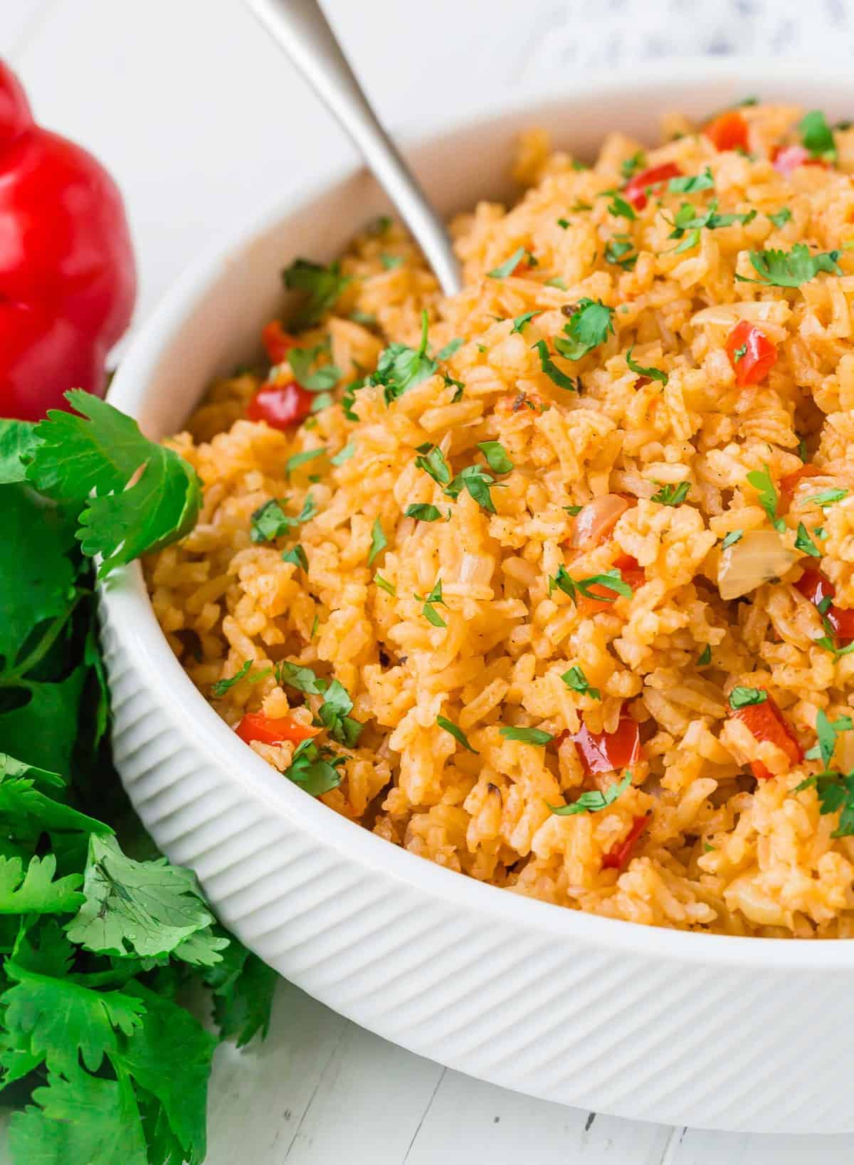 Rice in a bowl garnished with cilantro.