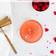 Pink drink in a stemmed glass, text overlay reads "raspberry rose spritzer, rachelcooks.com"