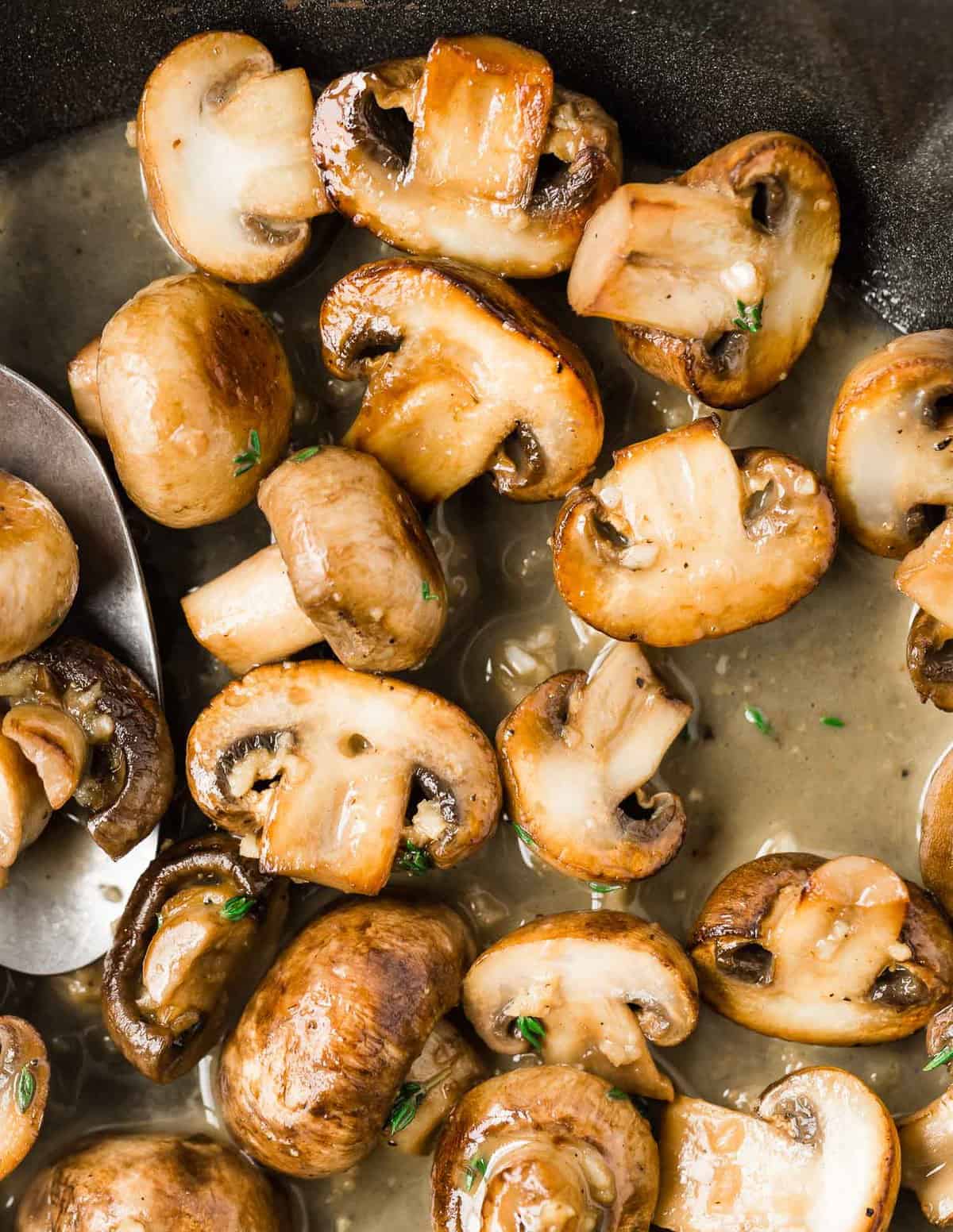 Close up of sautéed mushrooms.