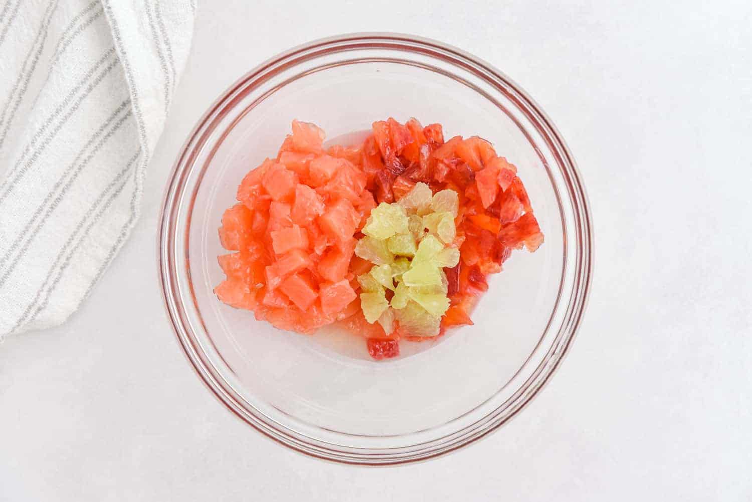 Diced citrus fruit in a bowl.