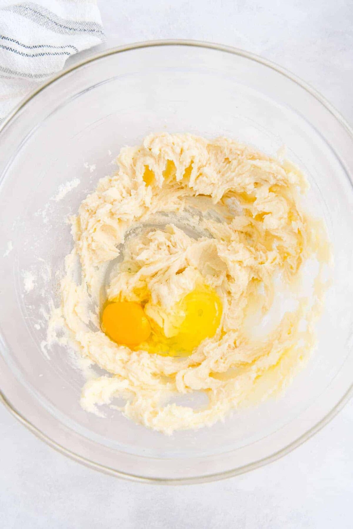 Egg added to butter and sugar.
