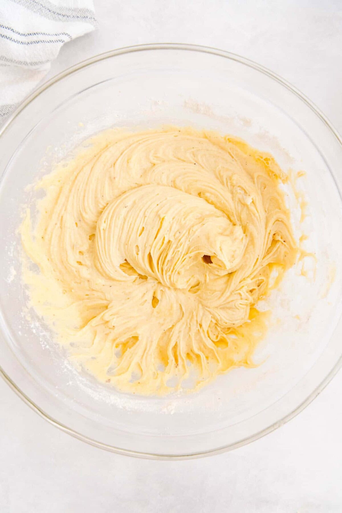 Batter in a clear glass mixing bowl.