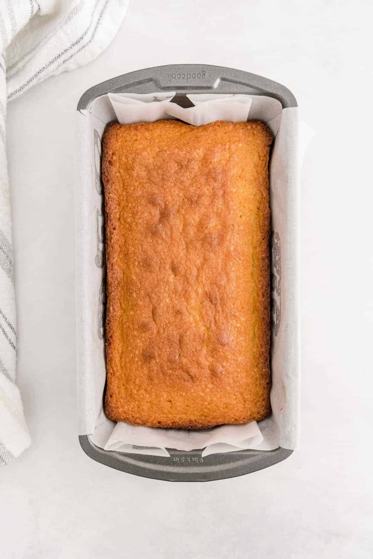Baked pound cake in a loaf pan.