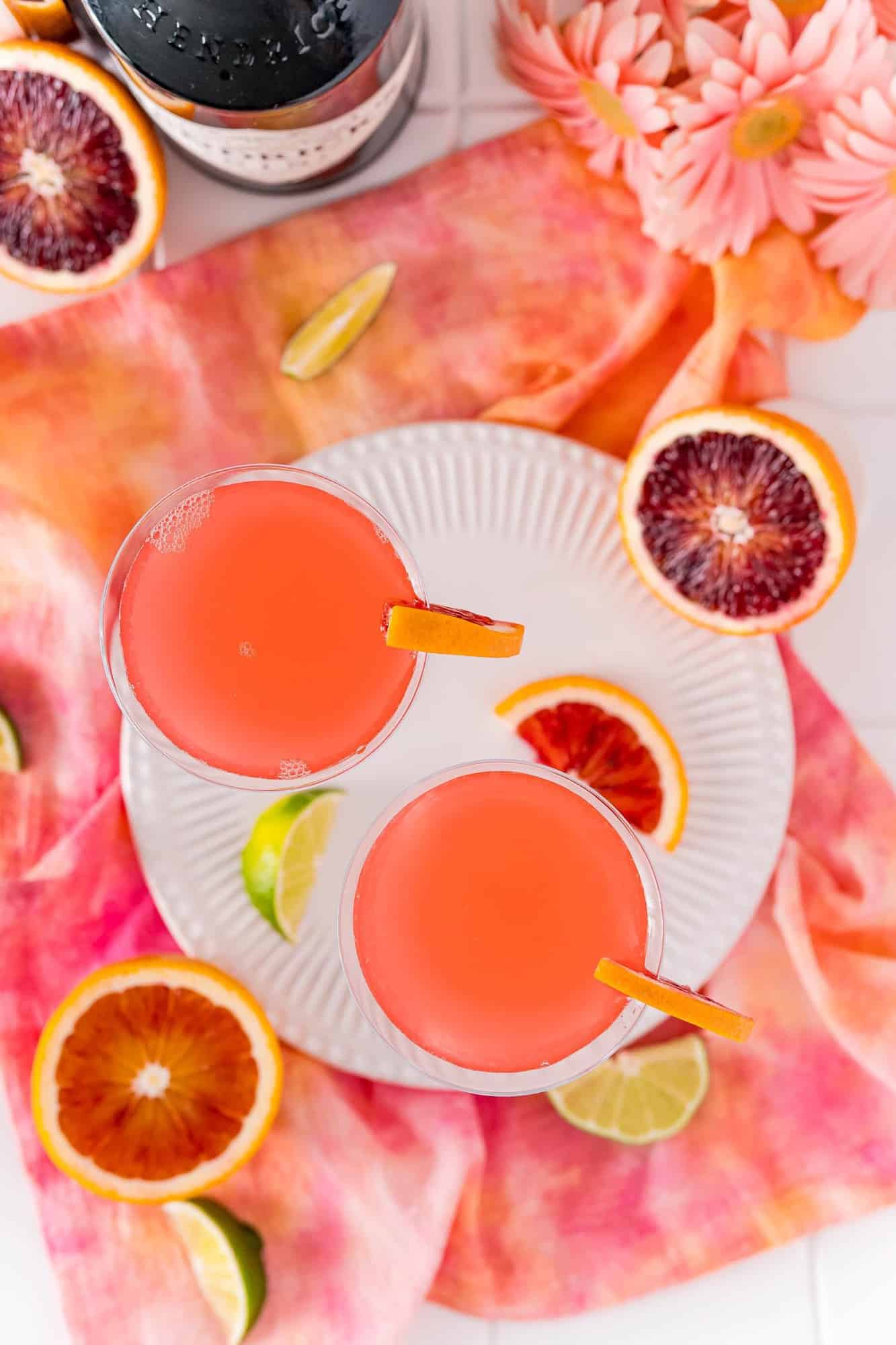 Overhead view of two blood orange martinis.