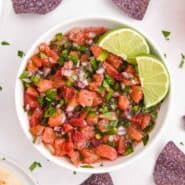Vibrantly colored salsa and chips, text overlay reads "citrus salsa - perfect on fish tacos! rachelcooks.com"