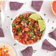 Vibrantly colored salsa and chips, text overlay reads "citrus salsa - perfect on fish tacos! rachelcooks.com"