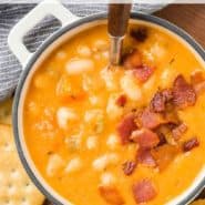 Soup in a white two-handled bowl, text overlay reads "homemade bean and bacon soup, rachelcooks.com"