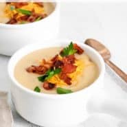 Soup in a bowl, text overlay reads "instant pot cauliflower potato soup, rachelcooks.com"