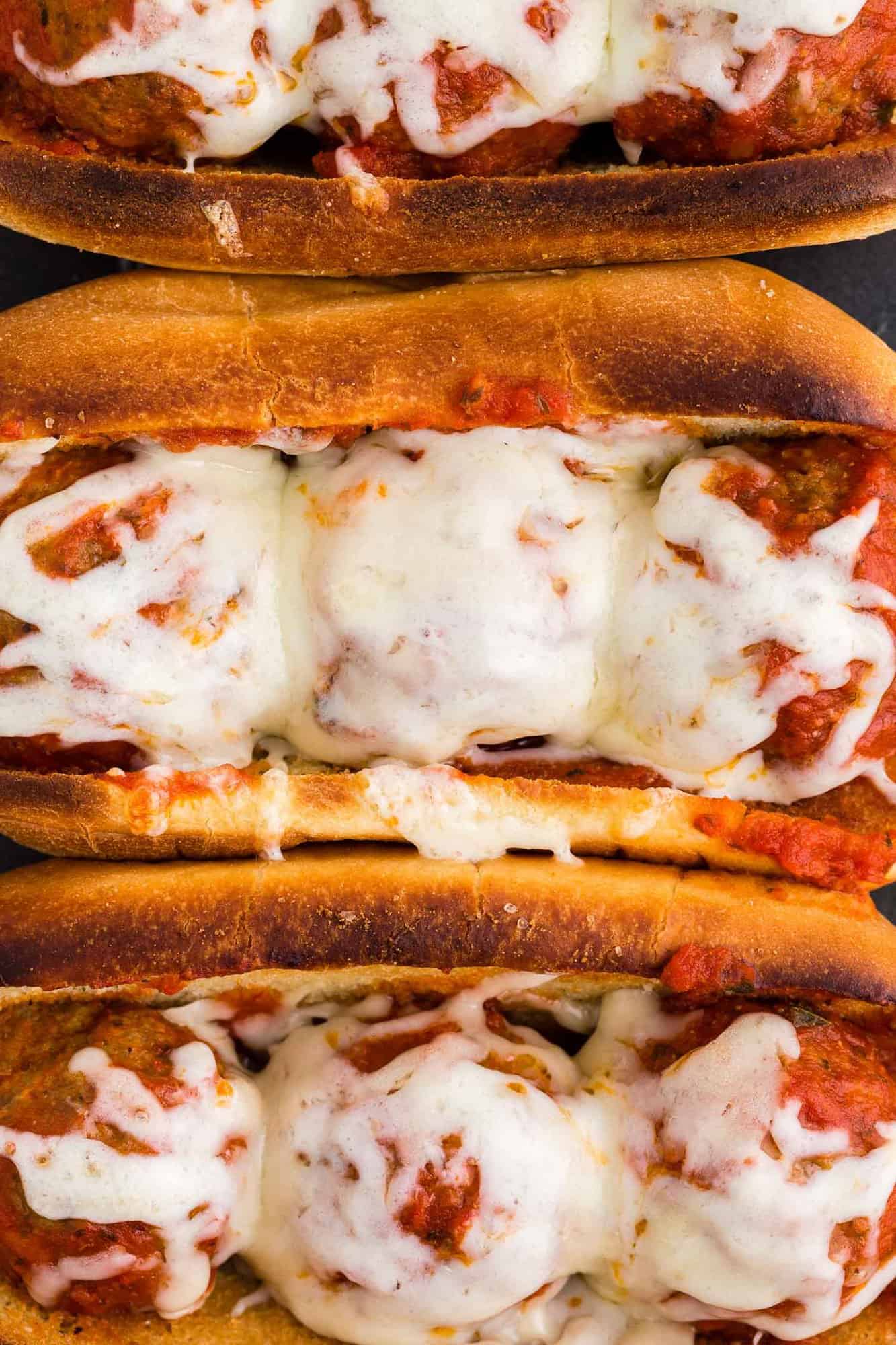 Close up view of melted cheese on a meatball sub.