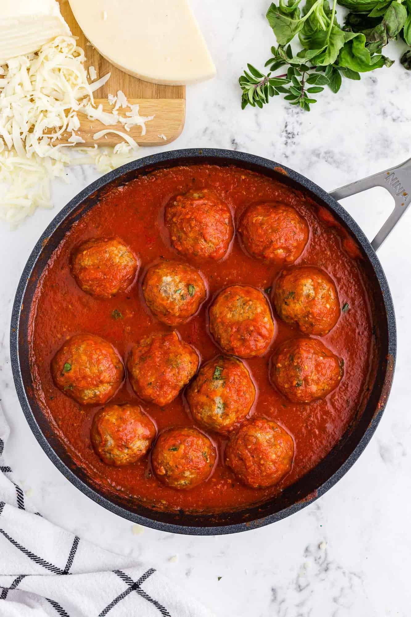 Meatballs and sauce in a pan.