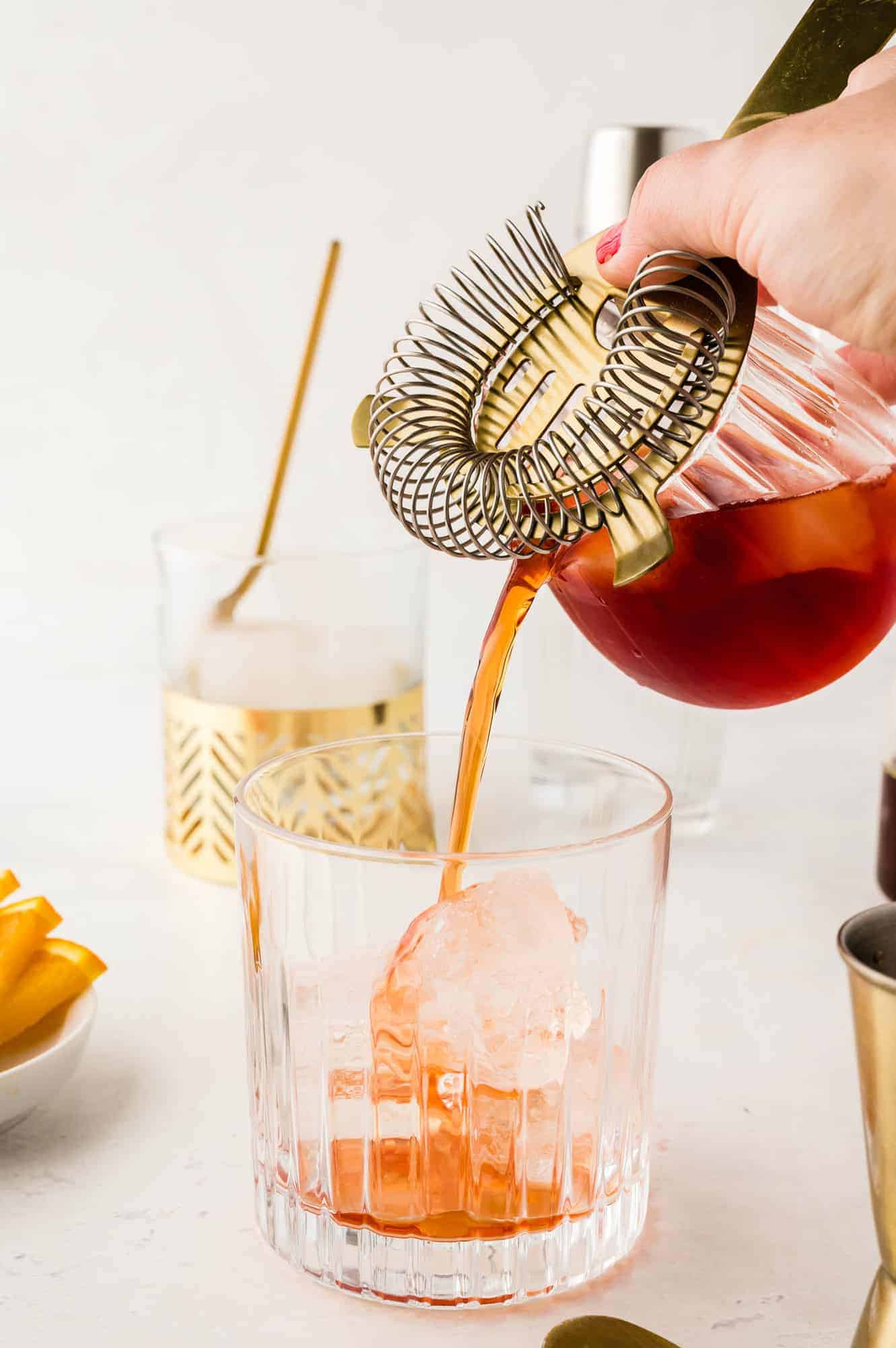 Drink being poured over ice.