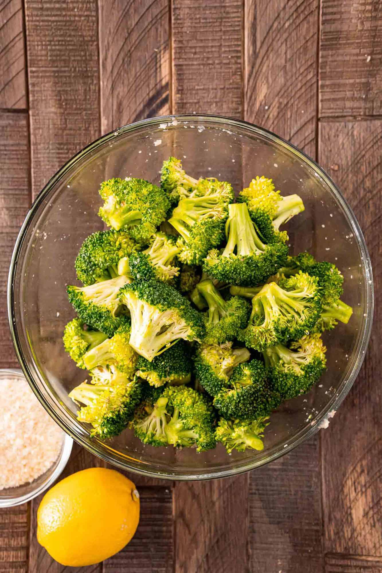 Broccoli in a bowl, white background.