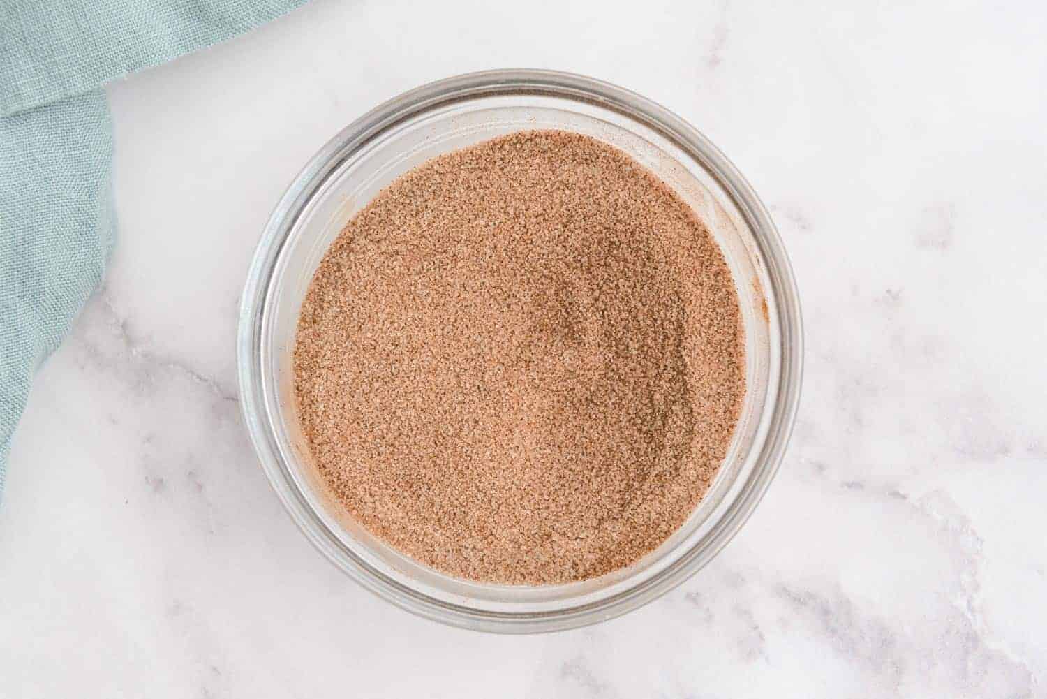 Cinnamon sugar in a glass bowl.