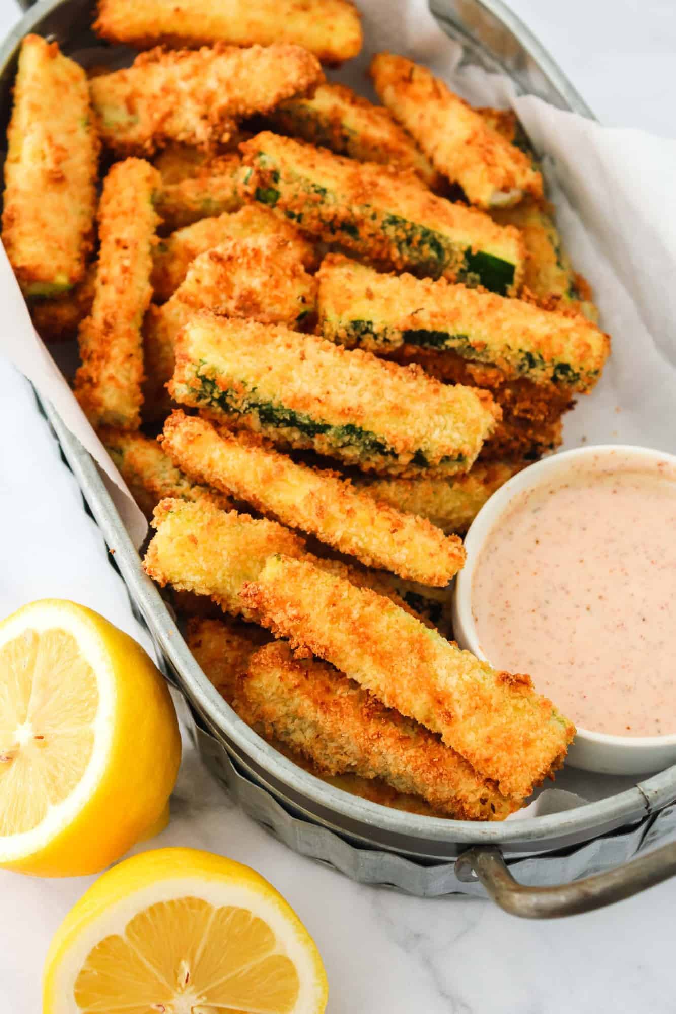 Large basket of breaded zucchini fries.