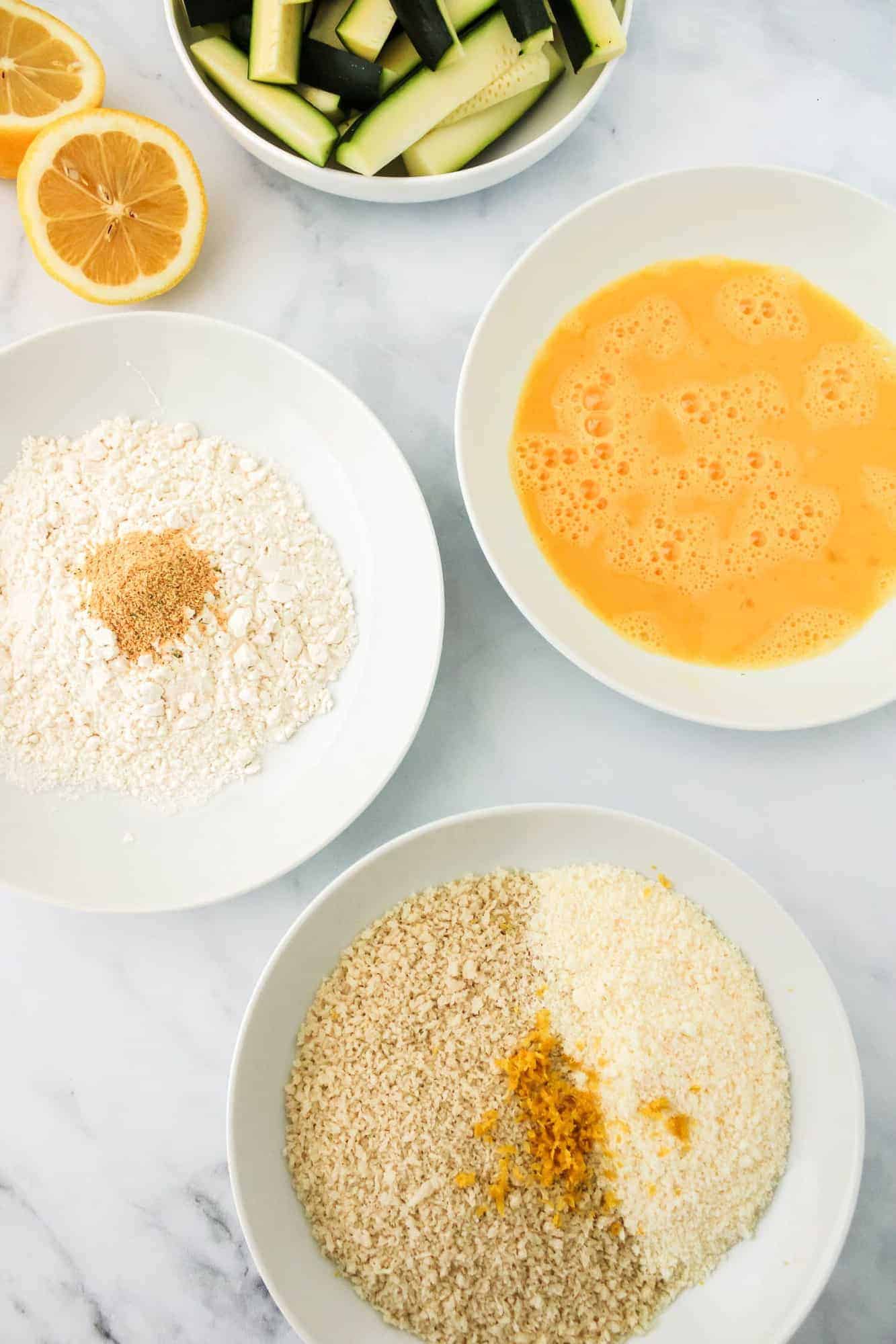 Three bowls showing breading steps and ingredients.