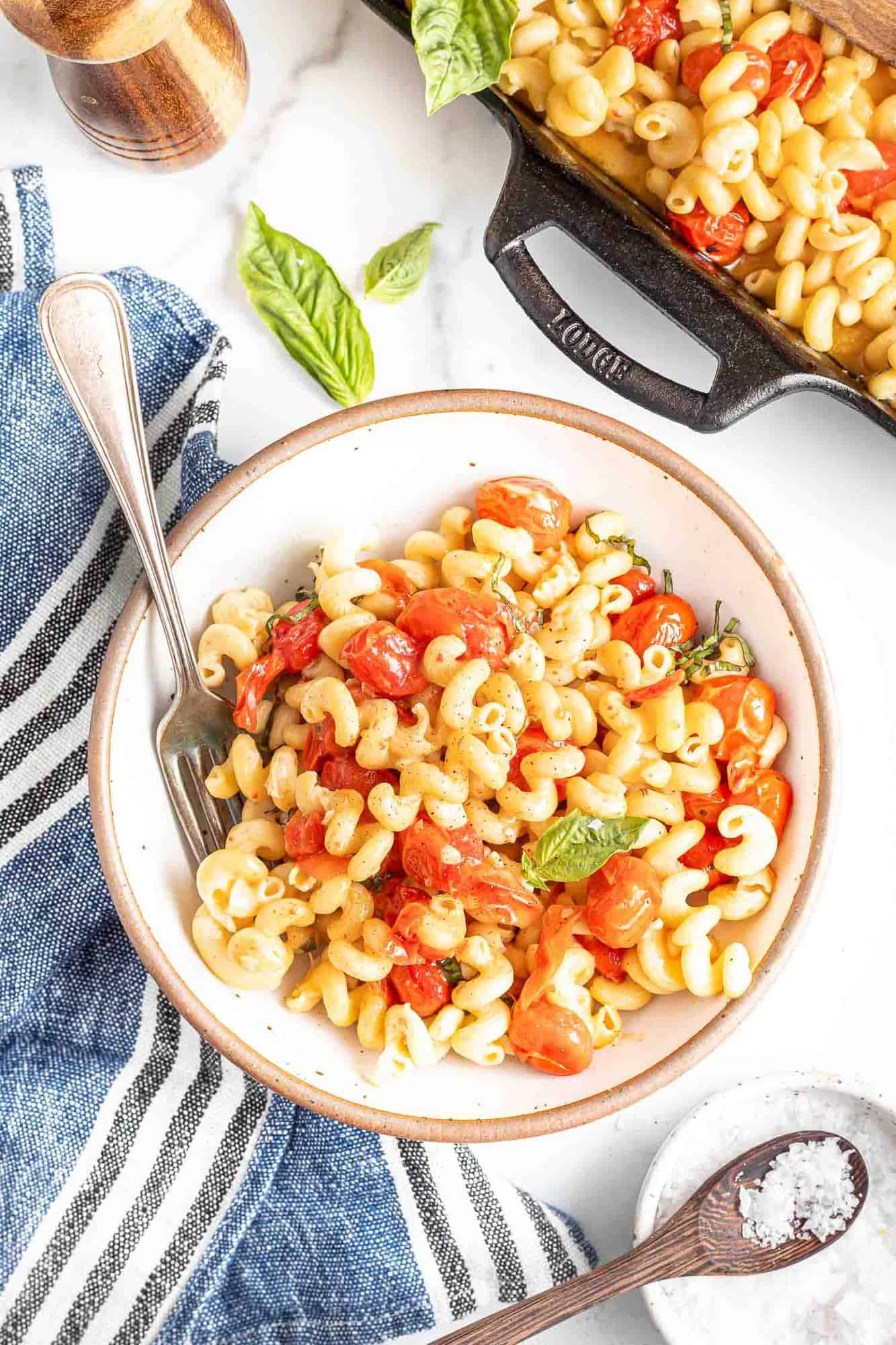 Bowl of feta pasta with roasted tomatoes.