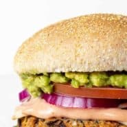 Close up of a vegetarian burger, text overlay reads "the best black bean burger."