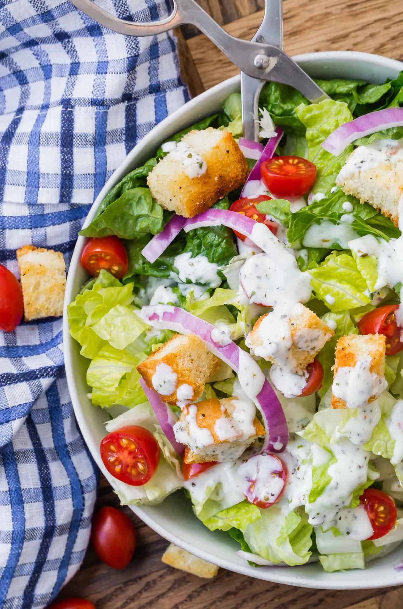 Tossed green salad with creamy white dressing.