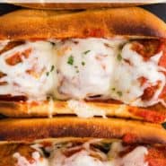 Cheesy meatballs in a bun, text overlay reads "the best meatball subs, rachelcooks.com"