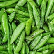 Bright green peas, text overlay reads "how to make sauteed sugar snap peas"