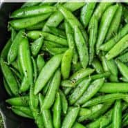 Bright green peas, text overlay reads "how to make sauteed sugar snap peas"