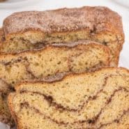 Bread with cinnamon swirl, text overlay reads "homemade snickerdoodle bread, rachelcooks.com"