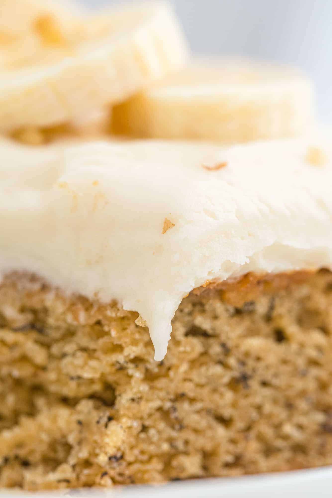Frosting draped over the side of a slice of cake.