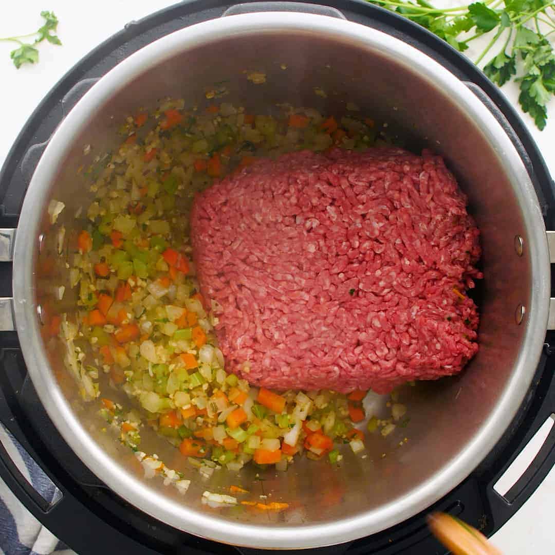 Raw grond beef in a pressure cooker.
