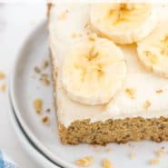 Cake on a plate, text overlay reads "the best homemade banana cake, rachelcooks.com"