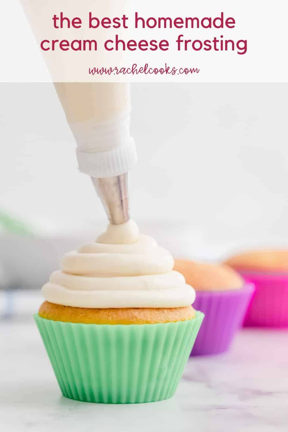 Frosting being piped on a cupcake, text overlay reads "the best homemade cream cheese frosting, rachelcooks.com"