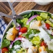 Tossed salad with white dressing, text overlay reads "easy creamy italian dressing, rachelcooks.com"