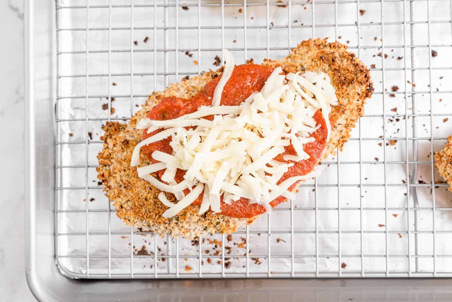 Chicken cutlet topped with marinara and mozzarella.