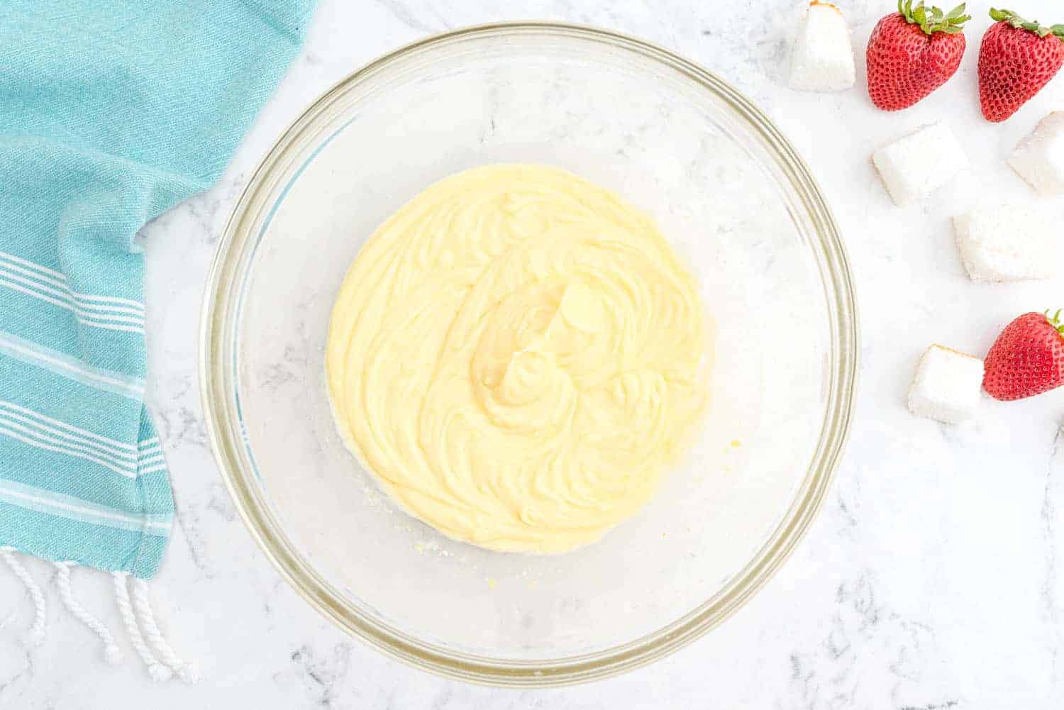 Pudding in a clear glass mixing bowl.