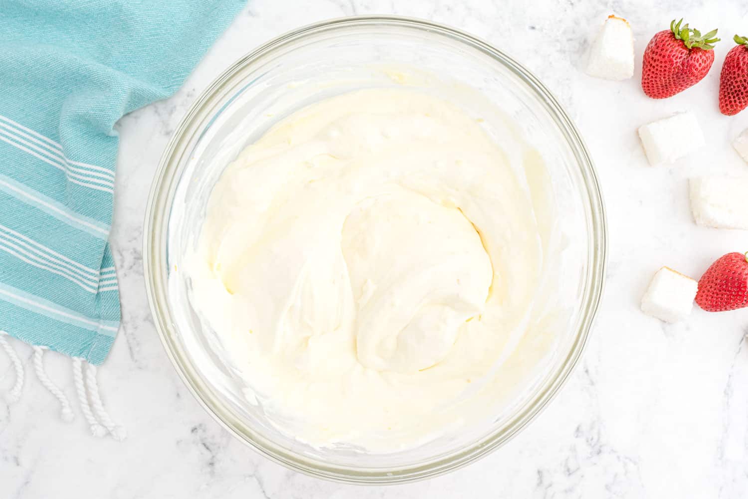 Very pale yellow orange mixture in a mixing bowl.