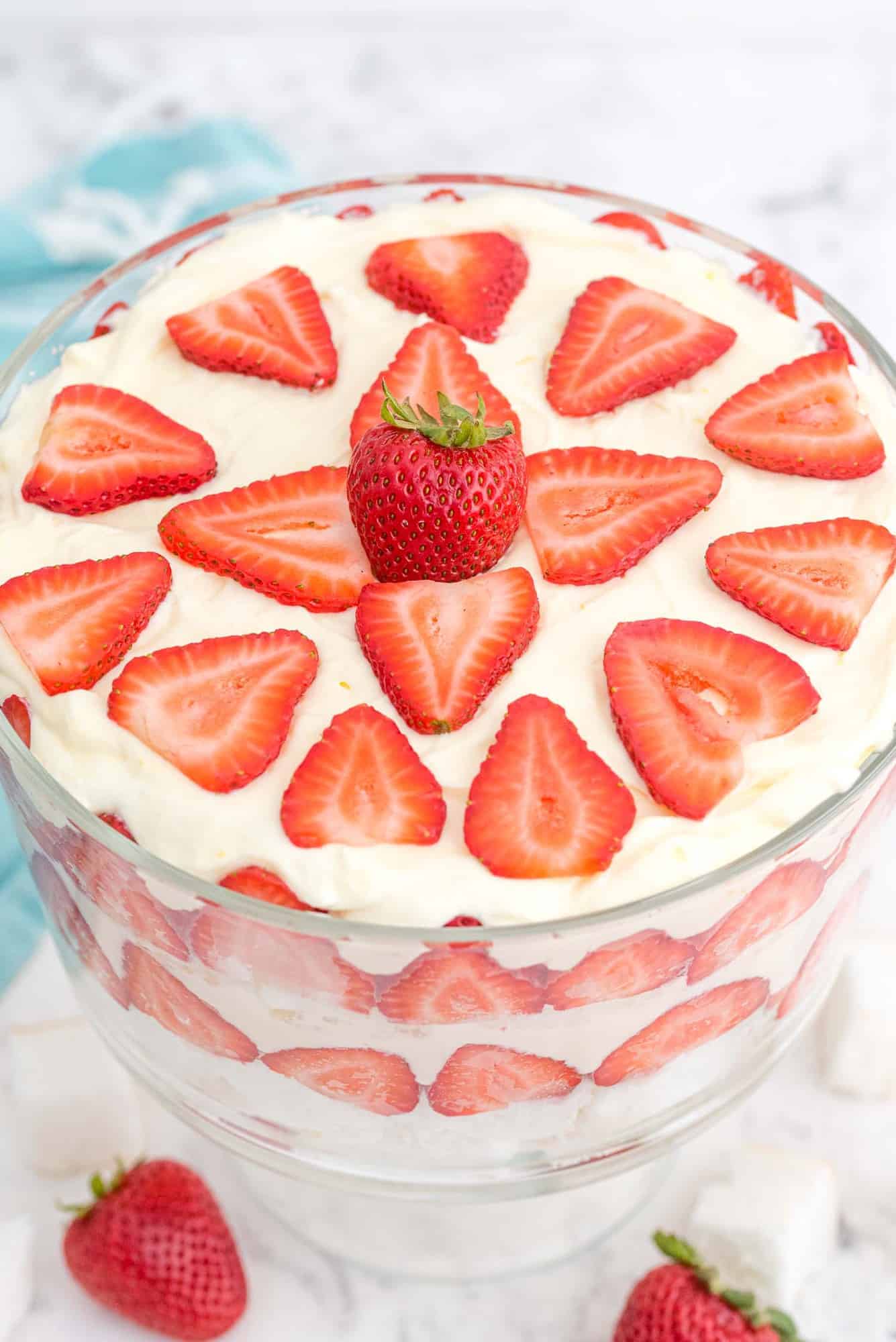 Trifle, decoratively topped with strawberries, viewed from above.