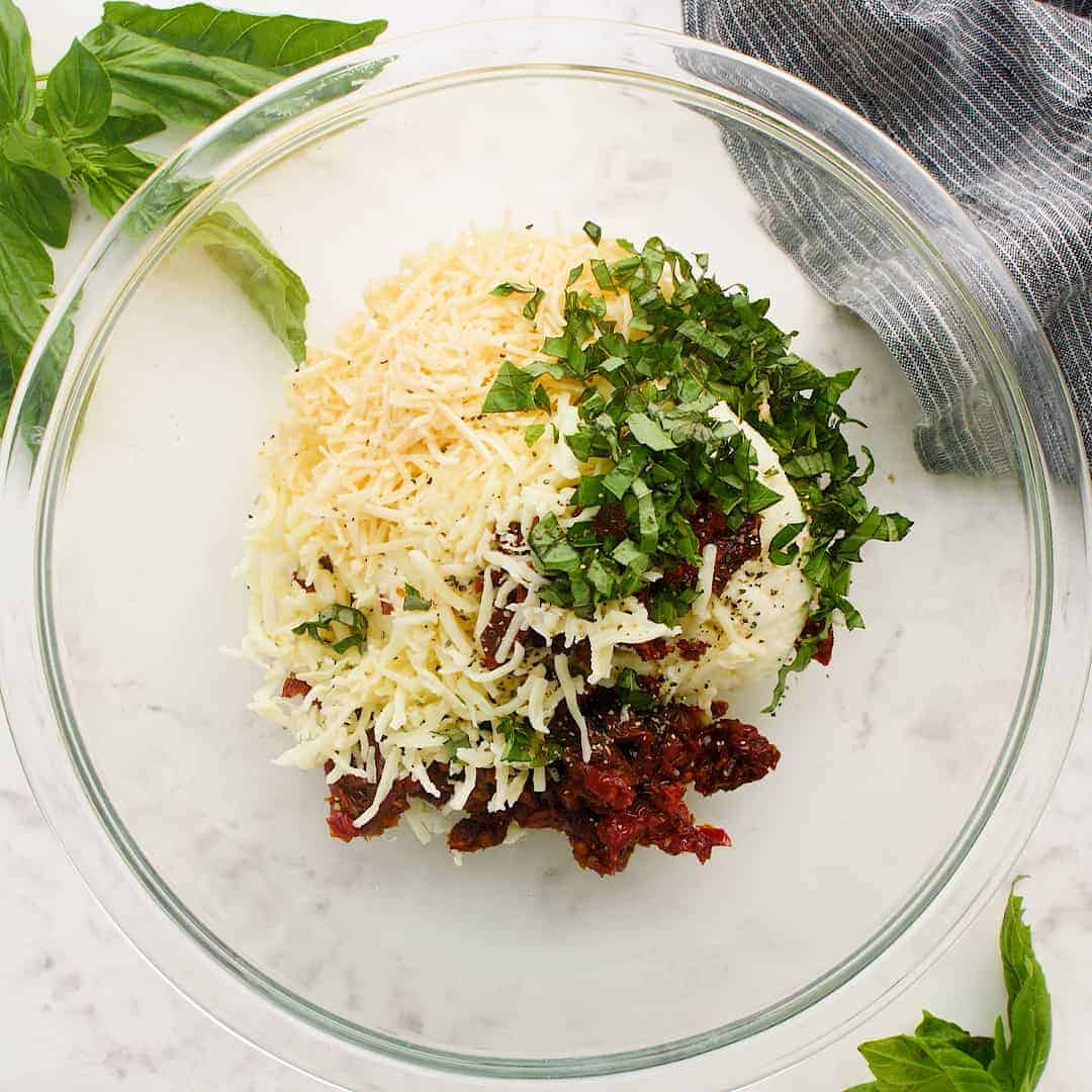 Filling ingredients in a glass mixing bowl.