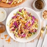 Overhead view of asian style salad in a white bowl.