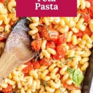 Pasta in a baking dish, text overlay reads "baked feta pasta."