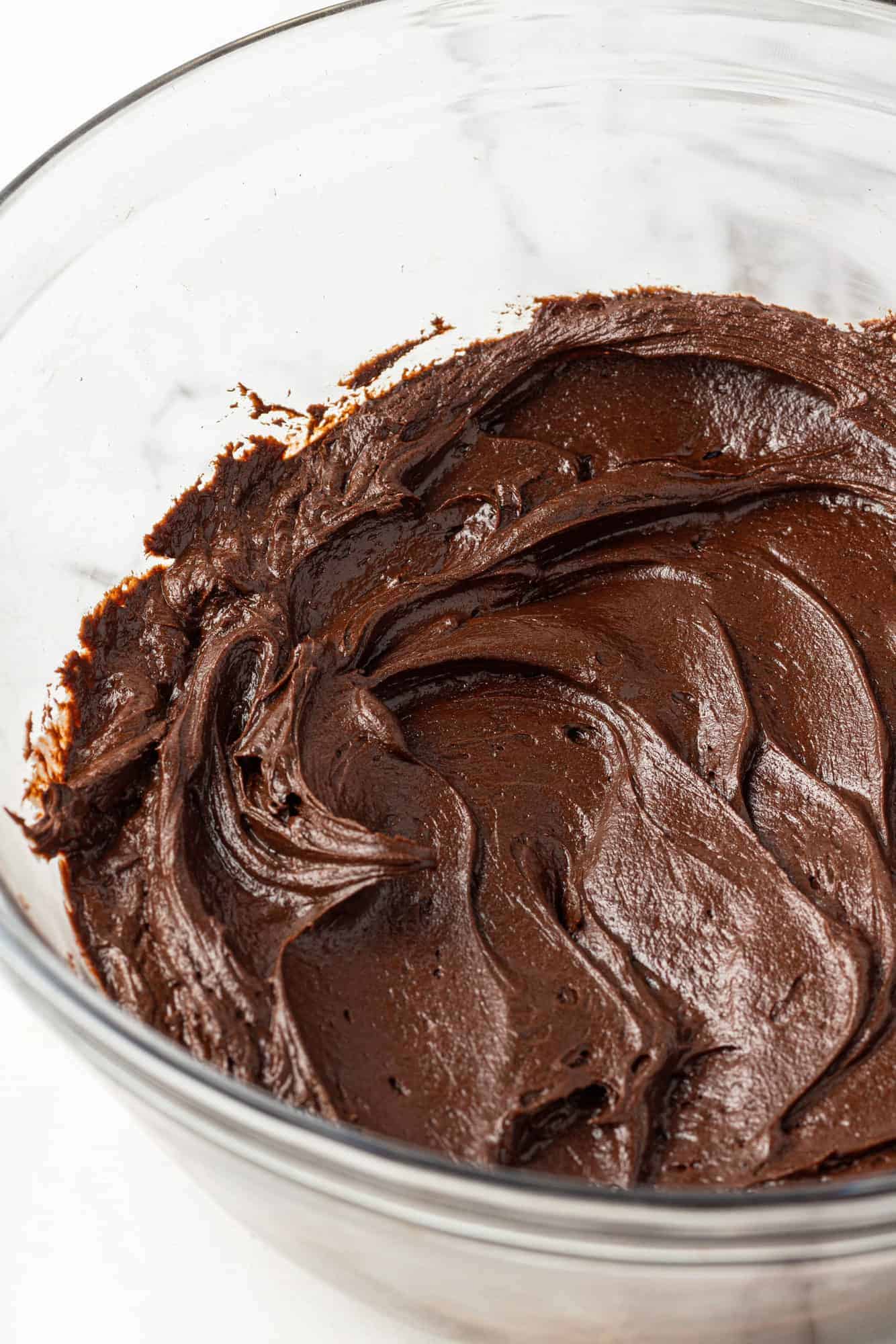 Frosting in a glass mixing bowl.