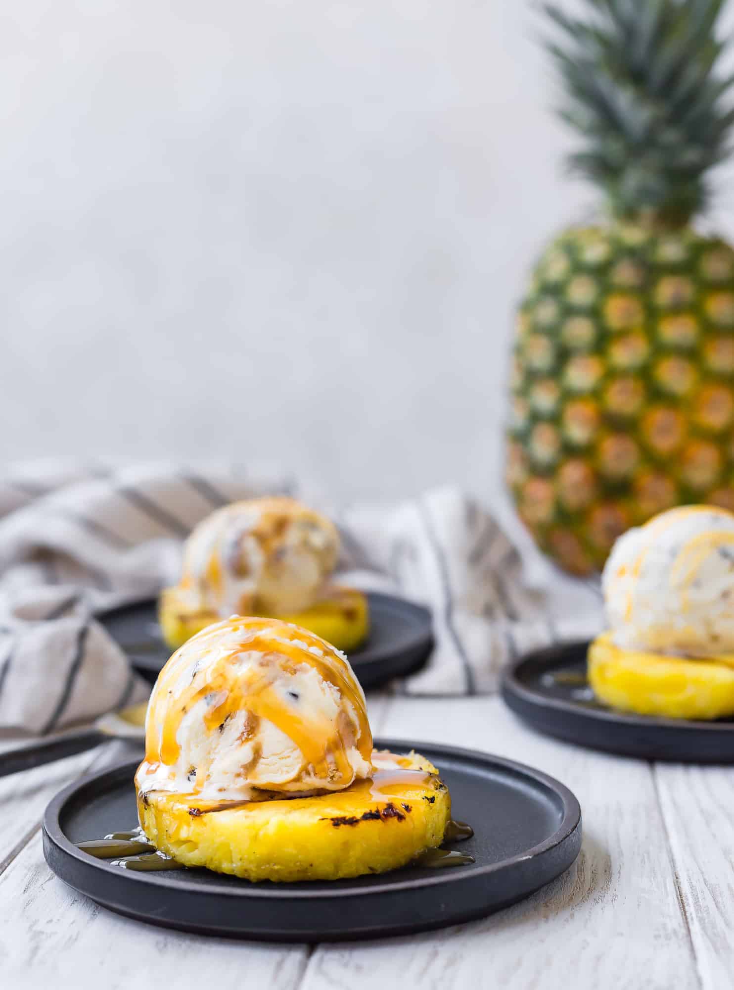 grilled pineapple topped with ice cream