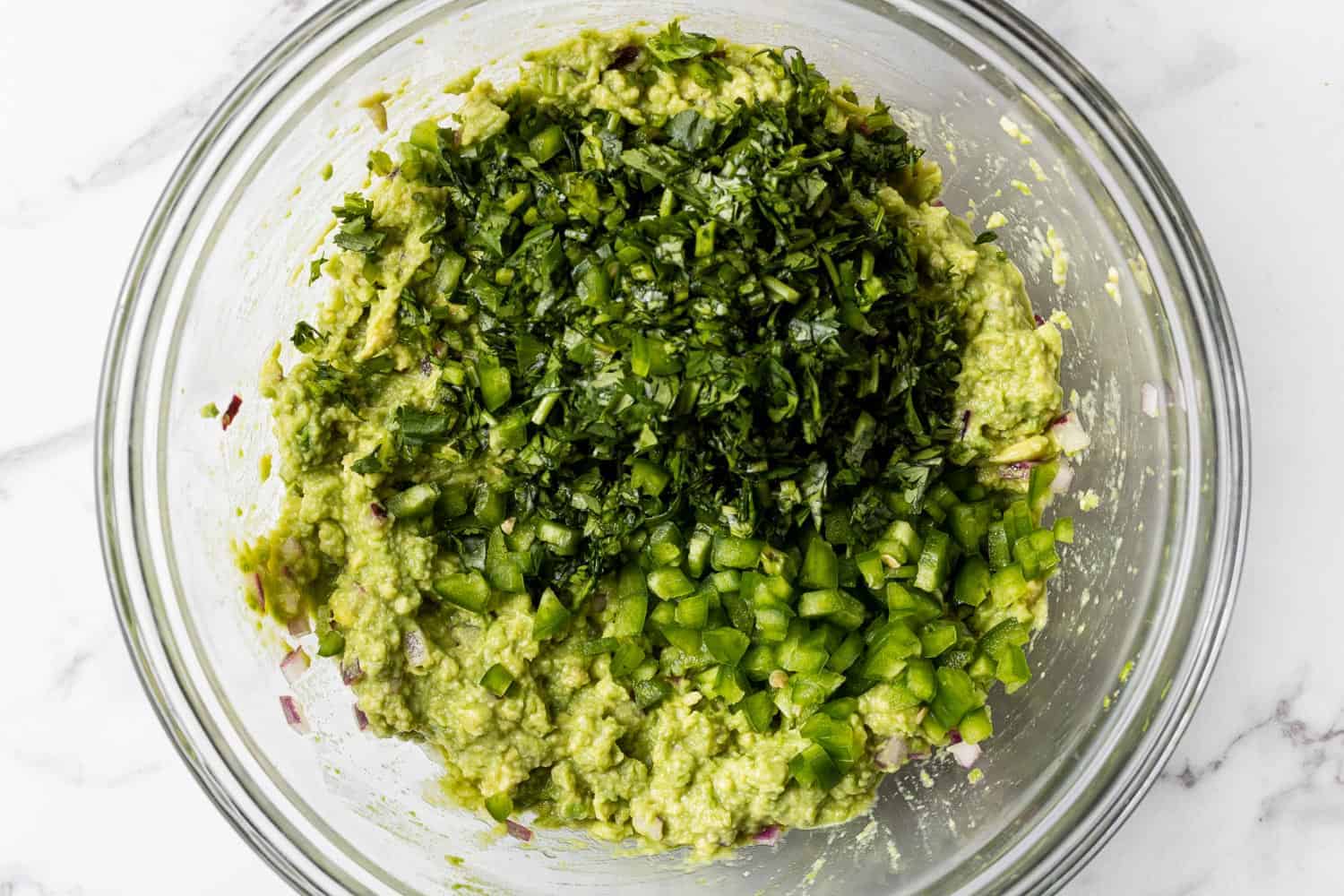 Jalapeno and cilantro on top of mashed avocado.