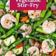 Shrimp and vegetables in a frying pan, text overlay reads "easy shrimp & vegetable stir-fry."