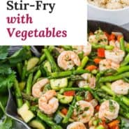 Shrimp and vegetables in a frying pan, text overlay reads "easy shrimp stir-fry with vegetables."